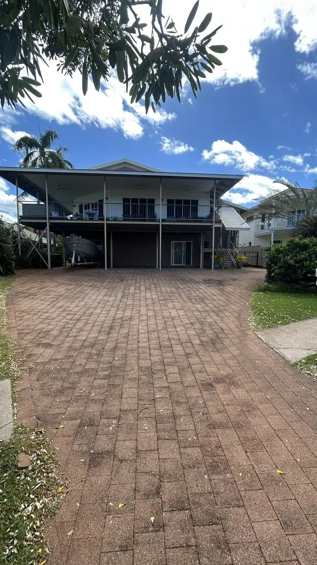 Front paver driveway before pressure washing